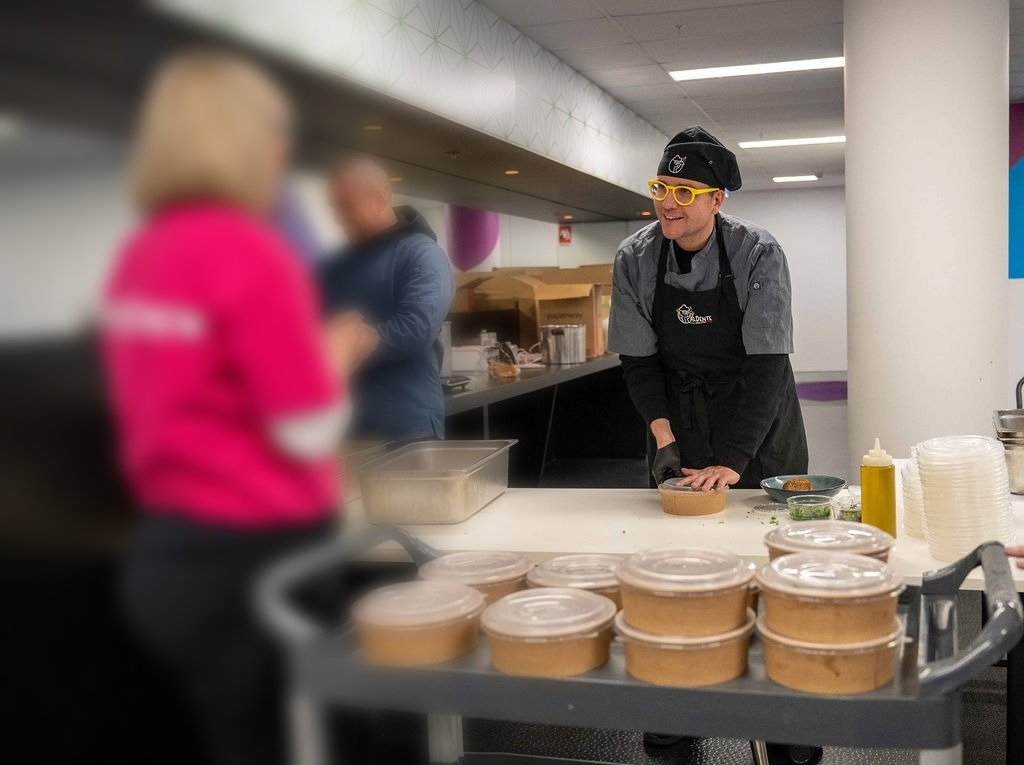 Chef Michele serving Italian corporate catering at a Sydney office