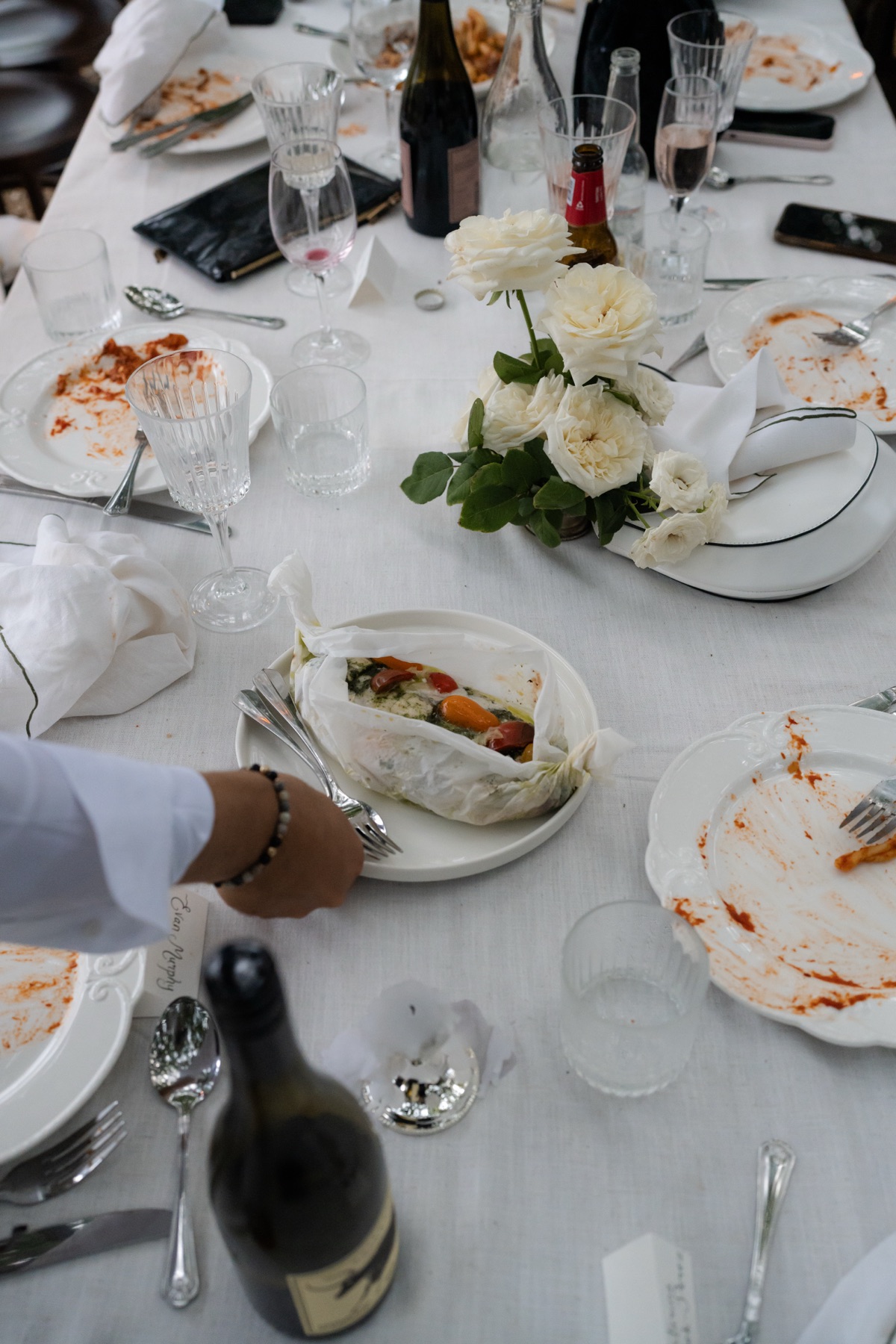 Michelone waiter serving a plated course to guests at a Sydney wedding reception